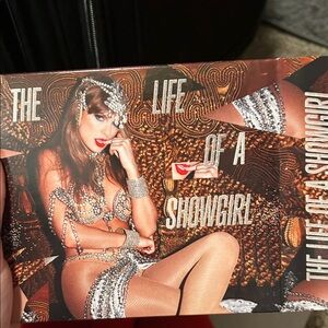 The Life of a Showgirl -silver bundle with not sure bracelet or keychain with ph